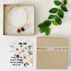 No. 139 gold bracelet with multiple color glass stones and verse card