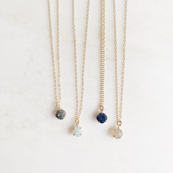 Guide stone and gold necklaces, grey, charcoal, mint, and navy