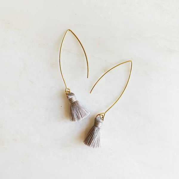 Grey tassel earrings on gold ear wire