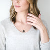 Woman wearing Laden druzy stone gold necklace