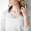Woman wearing Honey druzy stone gold necklace