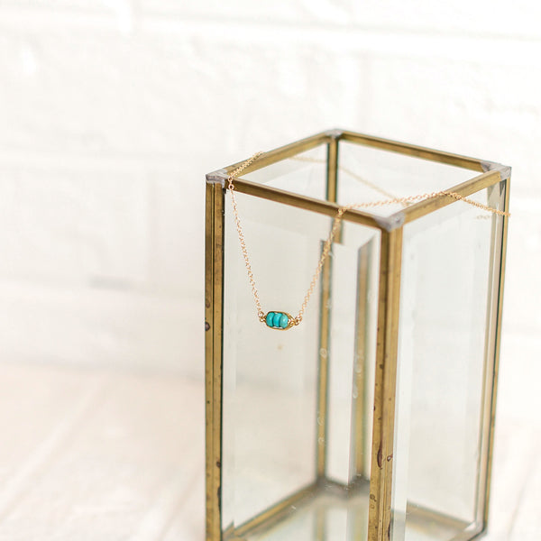 Gold Kinship necklace with turquoise beads