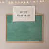 Do Not Grow Weary Endurance flag hanging by chalkboard