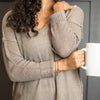 Woman wearing silver believe bracelet