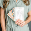 Woman holding scripture verse cards Promise Pack