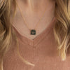 gold necklace square pendant with words come see engraved