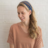 Woman wearing blue and brown headband