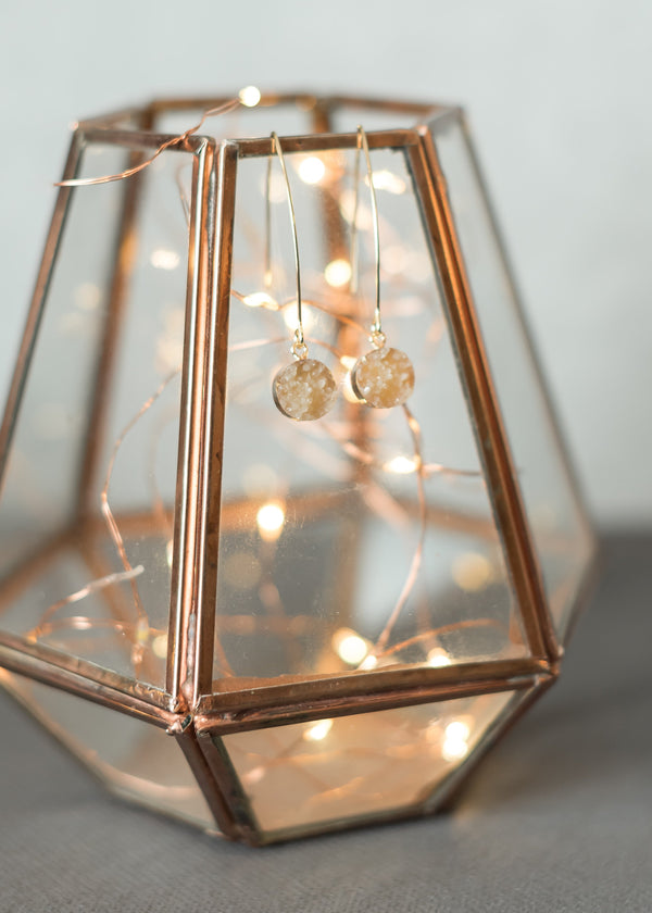 Befitting earrings and lamp