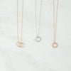 Trio ring necklace in gold, silver, and rose gold