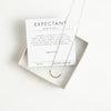Gold expectant necklace and verse card