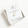 aid necklace and verse card