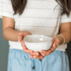 Woman holding ceramic ring dish