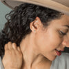Woman wearing daughter earrings