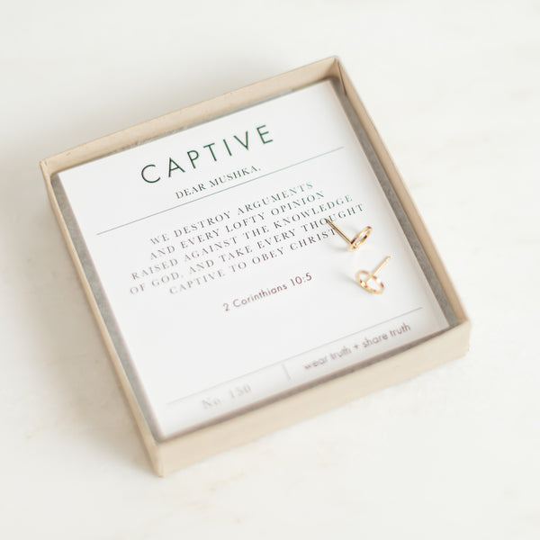 Gold captive earrings and verse card