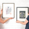Psalm 103 and Lamentations art prints framed in front of wall