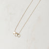 Gold necklace with charms