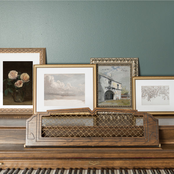 Vintage I AM art prints framed on top of a piano