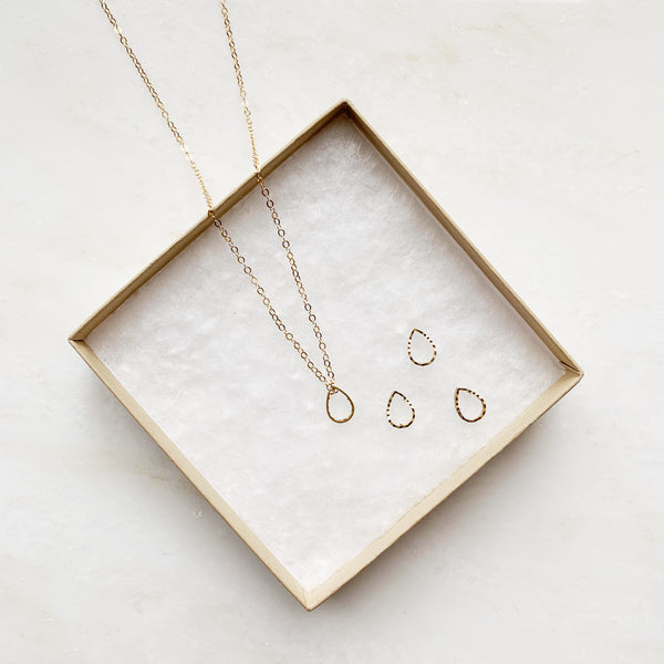 Keeper teardrop gold necklace and teardrop pendants on jewelry box