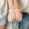 Women wearing companion bracelets